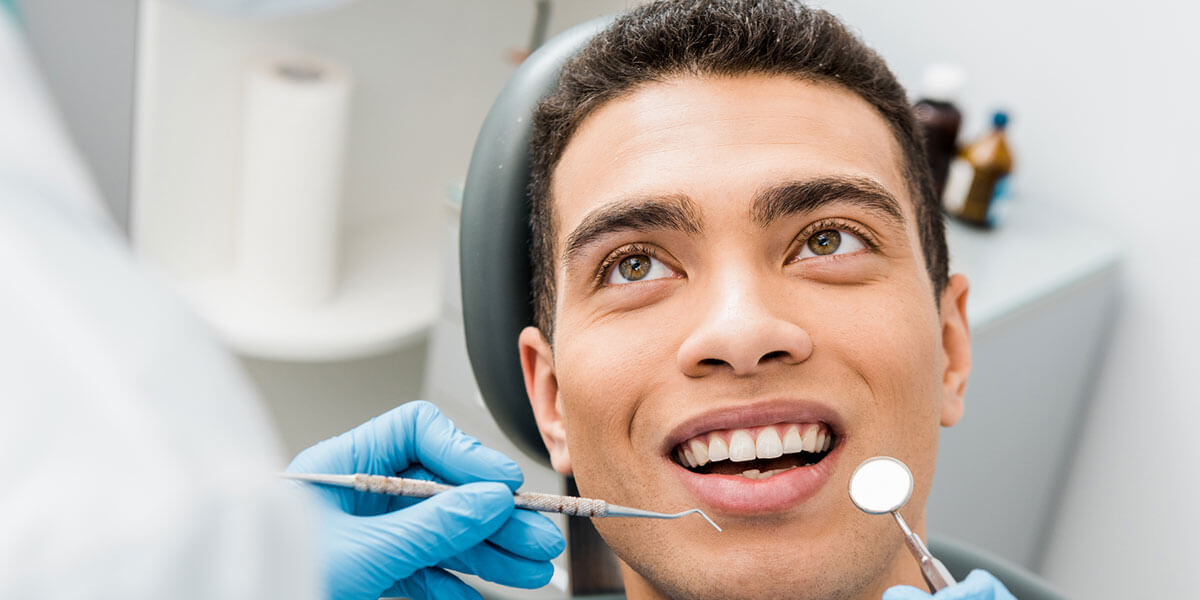 Young man in dental chair getting ready for dental check